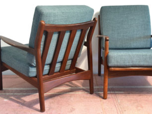 A pair of teak chairs